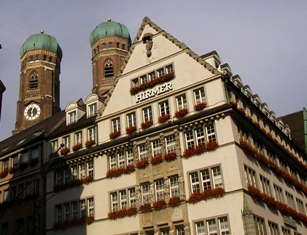 Old House in Downtown Munich with Frauenkirche in Background